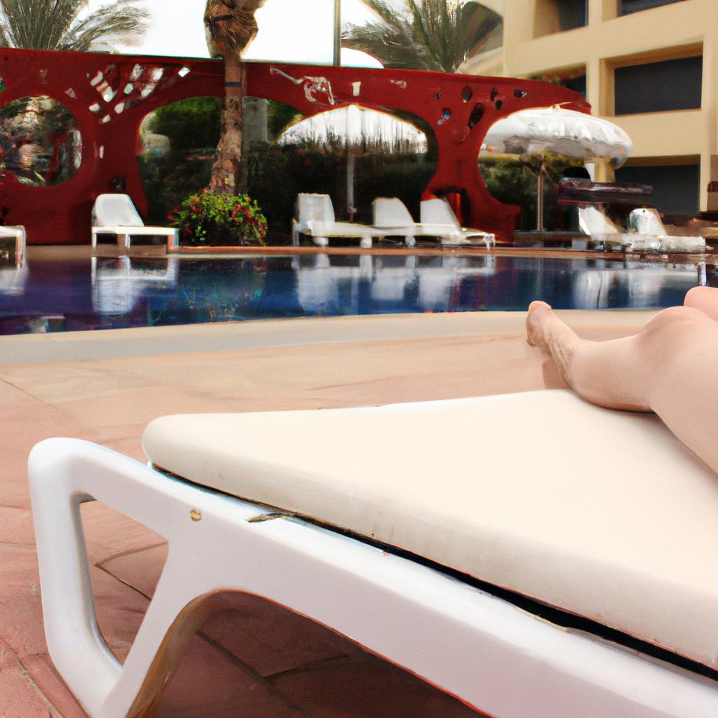 Person lounging by hotel pool